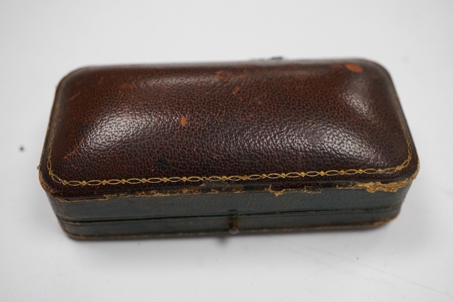 A late 19th century yellow metal and polychrome enamel desk seal, with rock crystal matrix, carved with a monogram, 69mm (small chip to the enamel), in original J.C Vickery fitted gilt tooled leather box.
